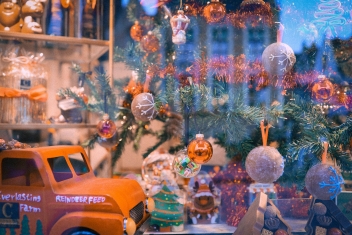 a toy truck is parked in front of a window